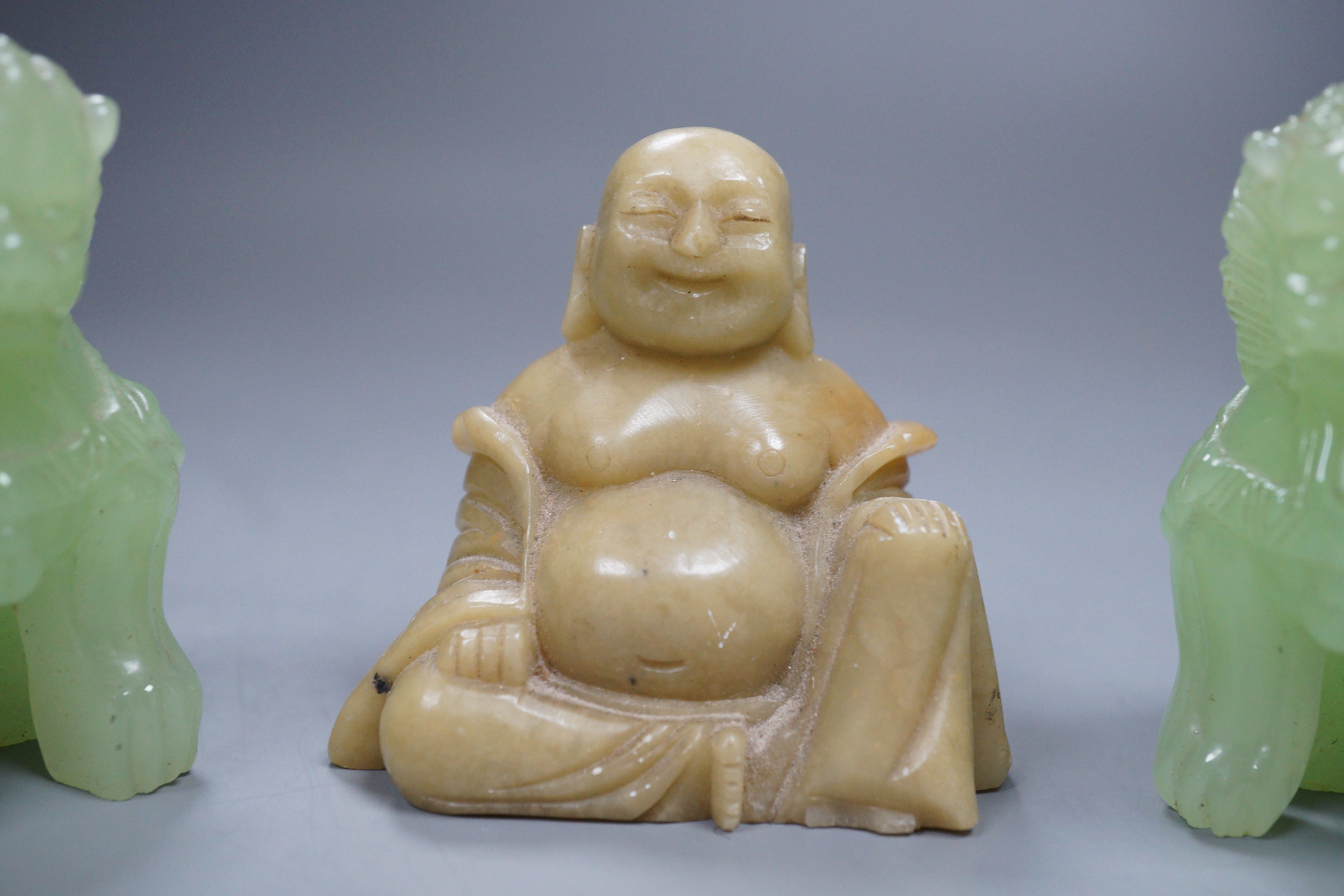 Two bowenite Buddhistic lions and a soapstone Buddha, 7cm